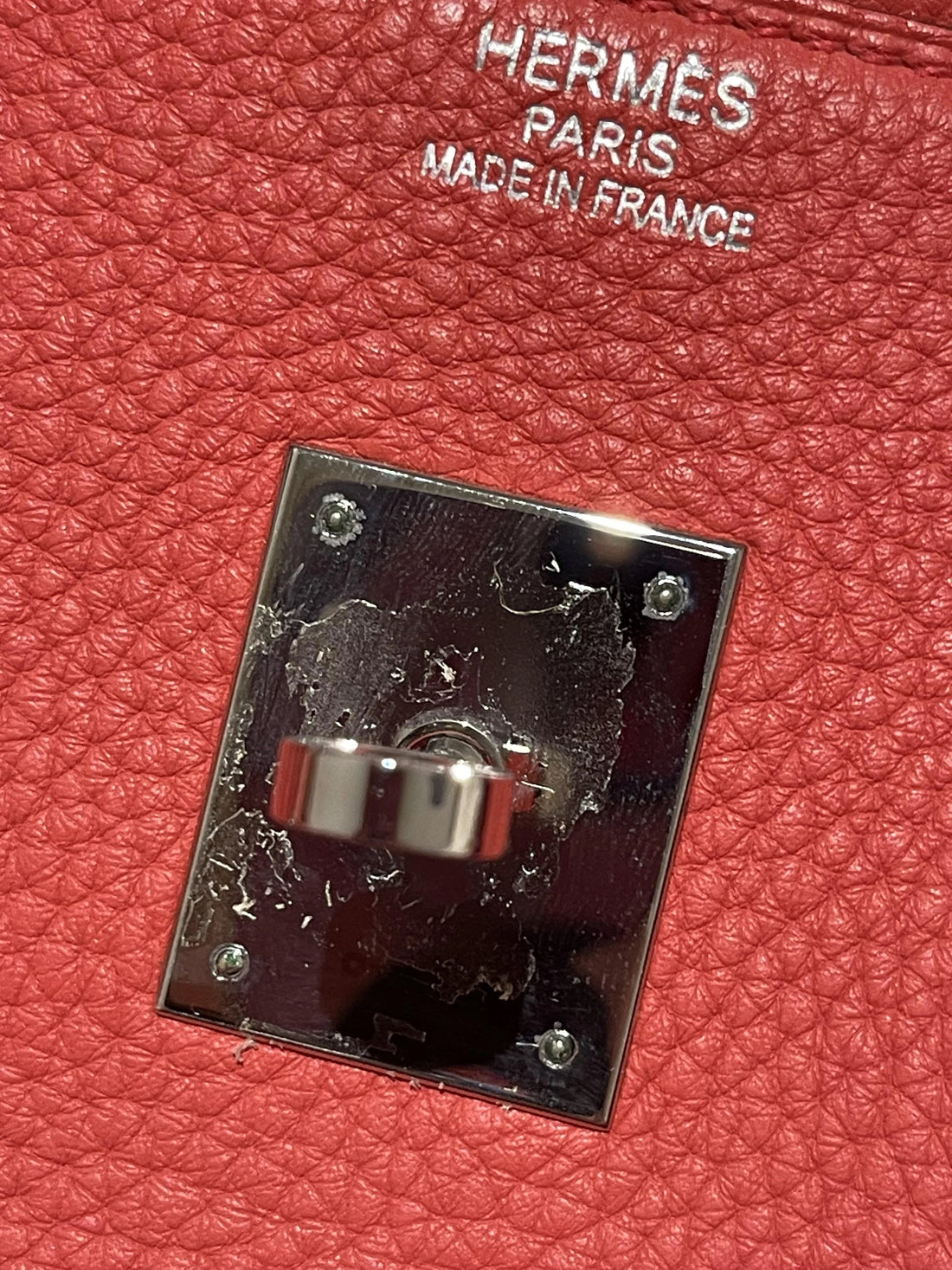 Hermès hardware's plastic stickers degrade and oxidised